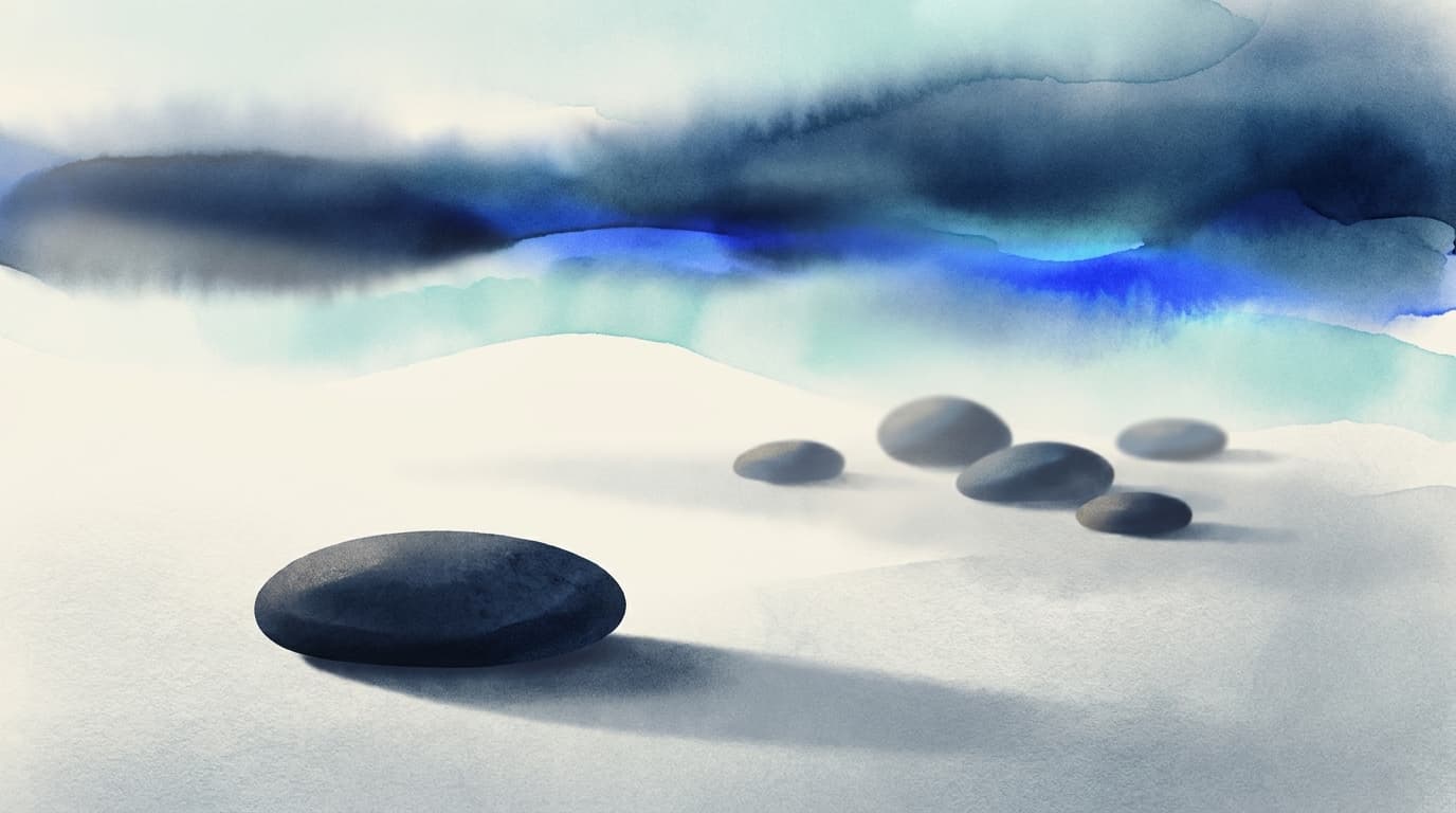 A single smooth stone resting on a still surface beside several scattered ones