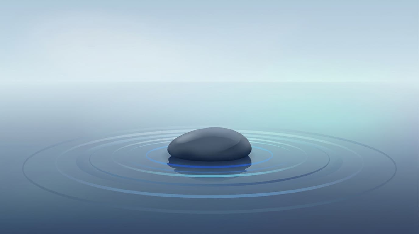 A single smooth river stone resting on calm water at dawn, soft grey and blue tones.